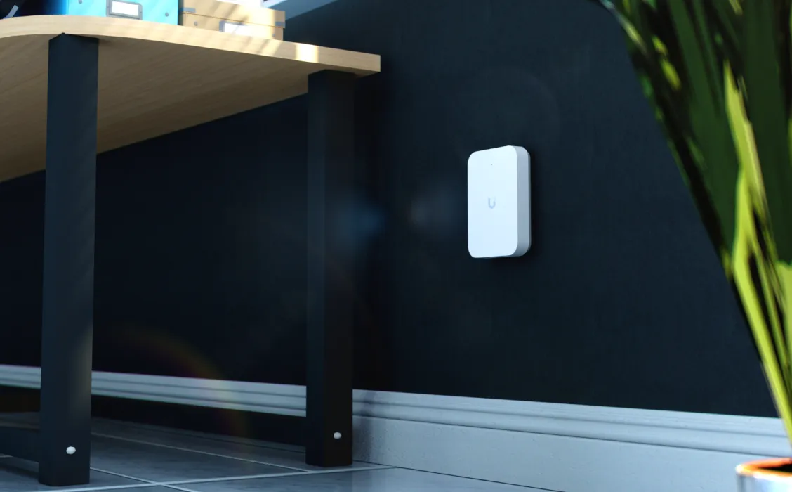 An in-wall access point with wired ports on a wall
